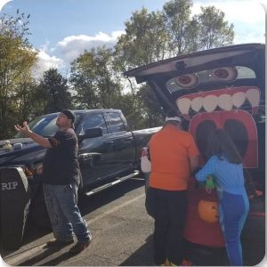 Visitors at a monster themed trunk during a previous Trinity Trunk or Treat